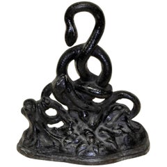 Mid-19th Century English Black Cast Iron Door Stop with Intricate Snakes Motif