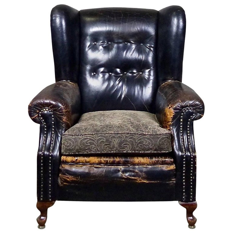 1920 Black Tufted Leather Lounge Chair at 1stDibs