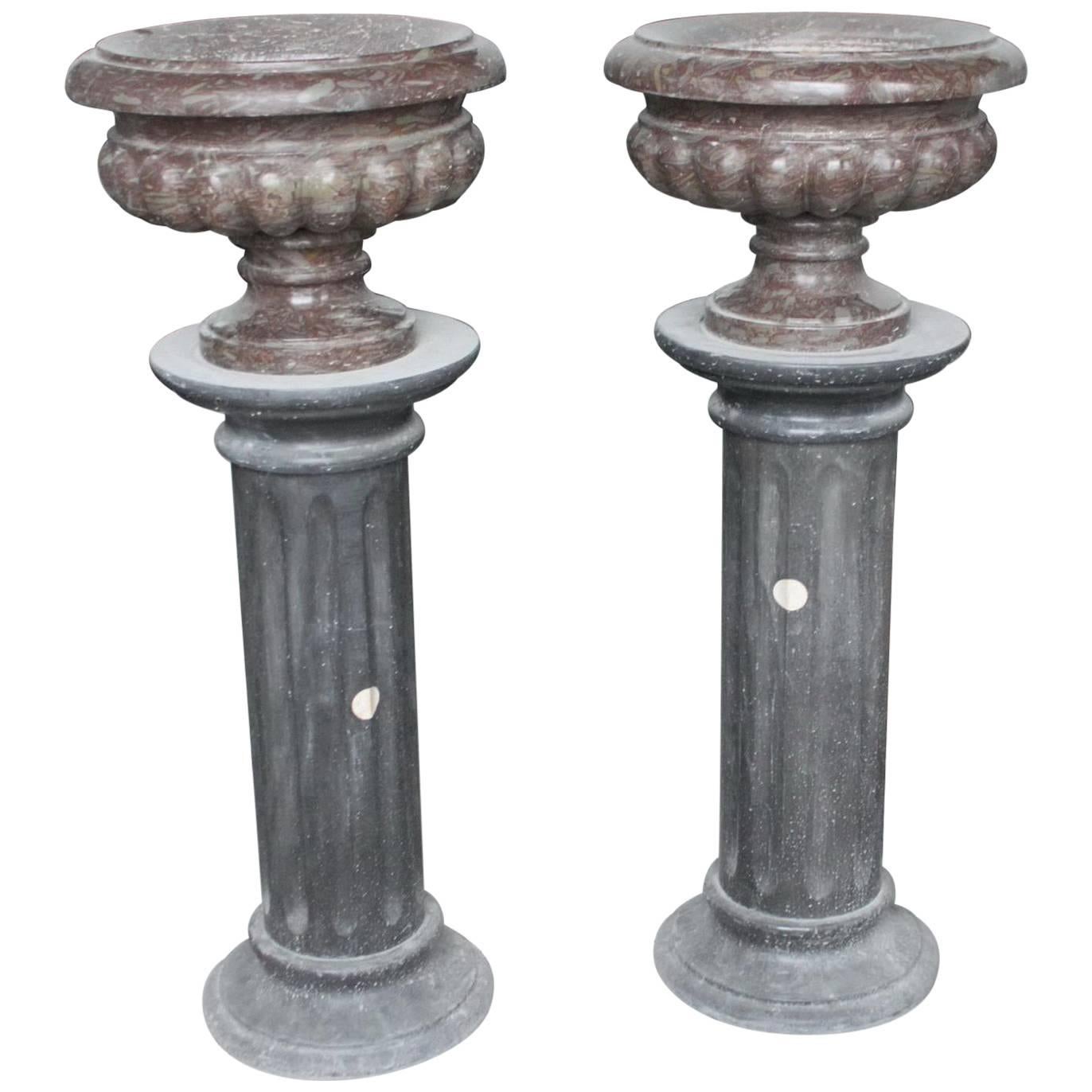 Pair of Rouge Purple Marble Urns on Black Marble Pedestals For Sale