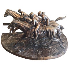 Bronze Horses in a Race with Jockeys