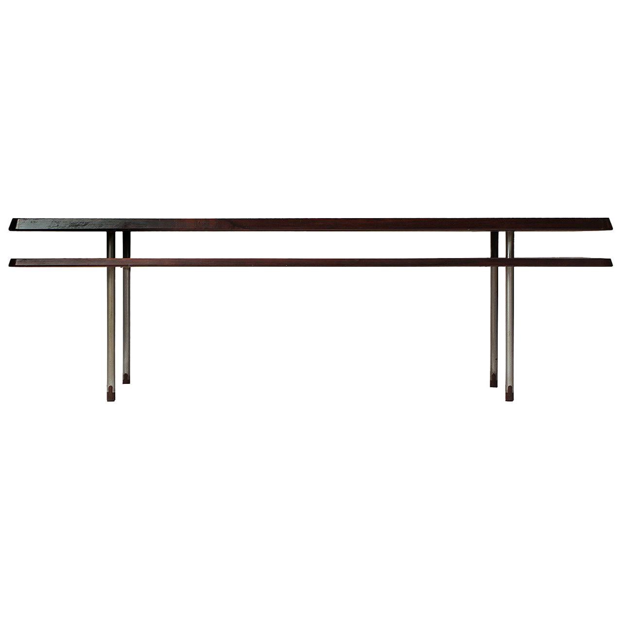 A rare and finely detailed two-tiered Scandinavian Modern table designed by Johan Hagen in highly figured rosewood with tubular rosewood-tipped brushed steel legs. Made in Denmark, circa 1950s. This table was exhibited at the Danish cabinetmakers