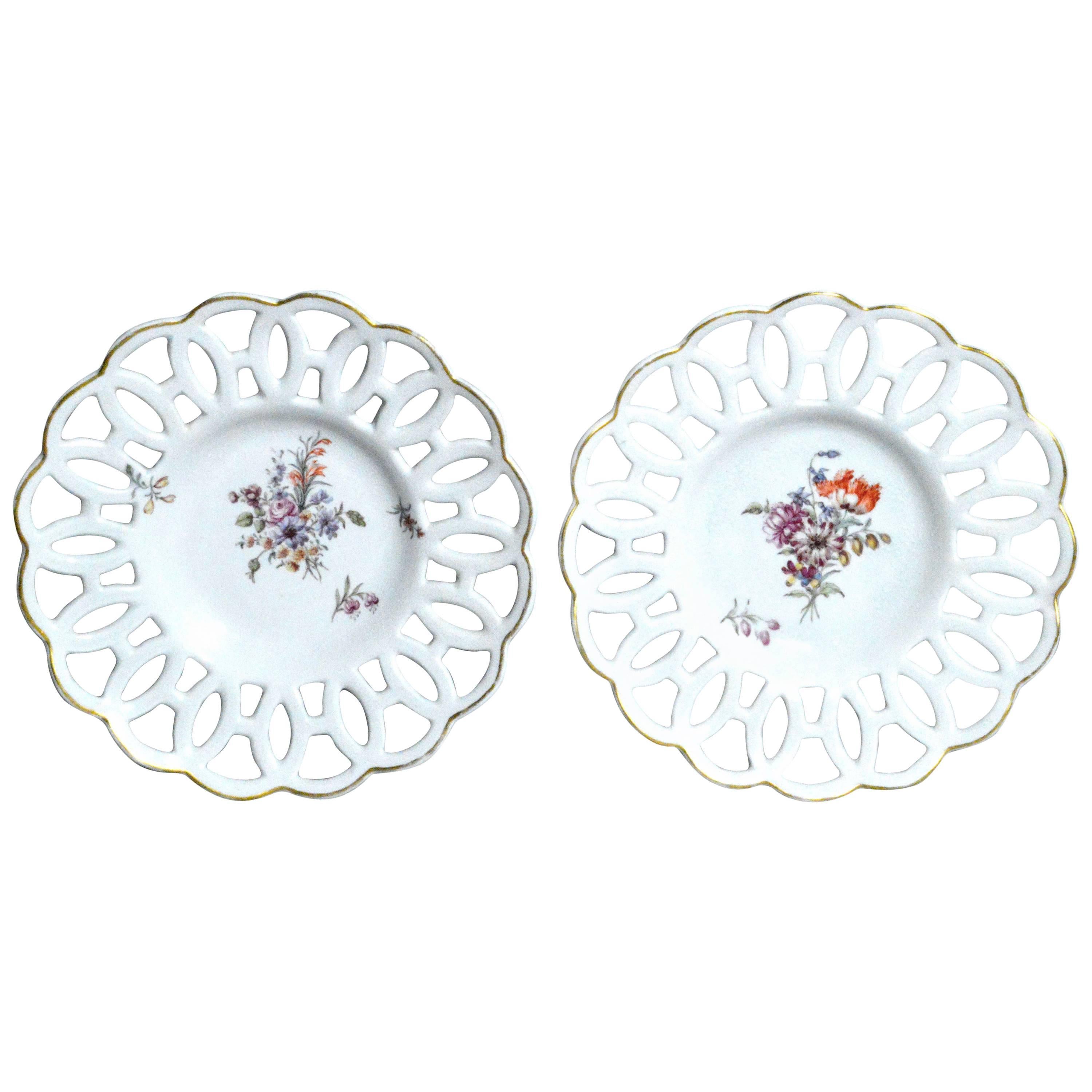 Chelsea porcelain reticulated circular dishes, Gold anchor period, circa 1760.

The Chelsea porcelain dishes with circular lattice rims and a simple gilt band are beautifully painted with an off-center bouquet of painted flowers with a single