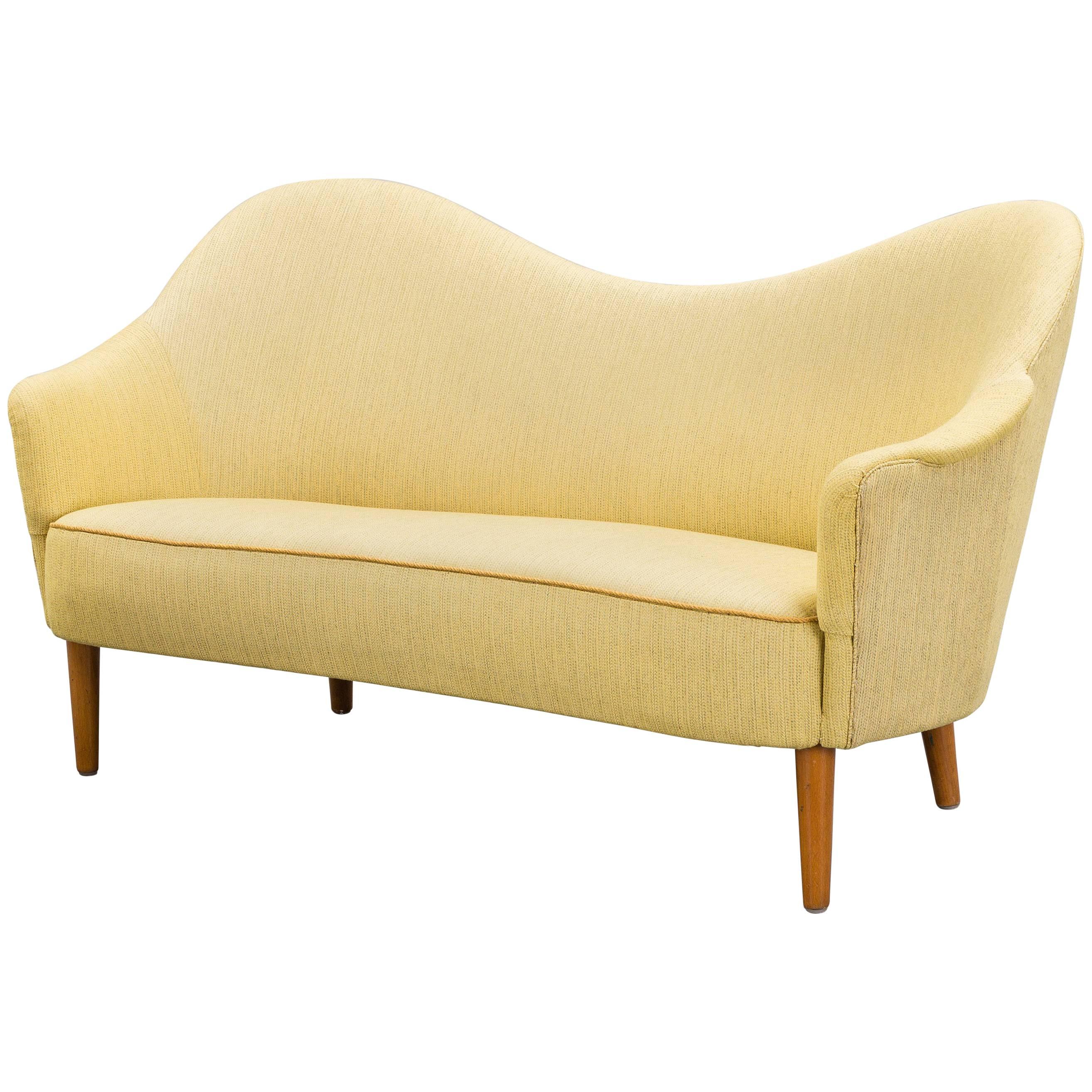 Carl Malmsten curved yellow Samspel sofa / loveseat, mid 20th Century, Sweden.