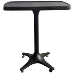 Black plastic side table with wheels