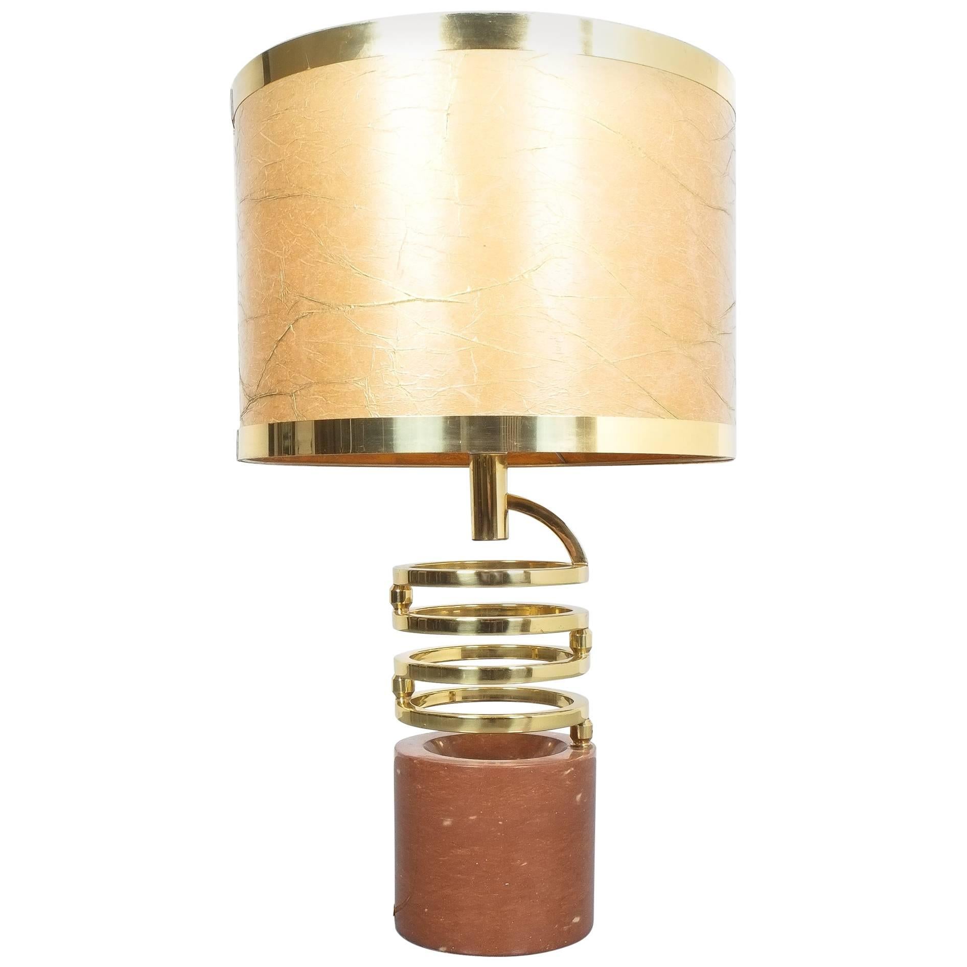 Willy Rizzo adjustable table lamp for BF,  Red marble brass, 1970. Rare adjustable table lamp with a heavy foot from red marble and revolvable rings from brass. Original 1970 shade. The condition is very good, the joints are working fine, extended
