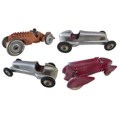 Collection of Four 1930s Metal Streamline Toy Cars