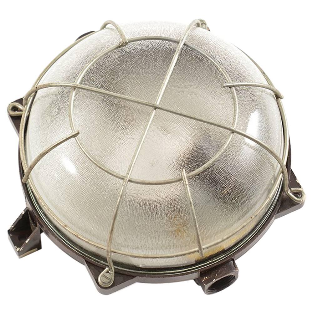 Industrial Ceiling/Wall Light in Bakelite and Glass with Metal Cage, circa 1950 For Sale