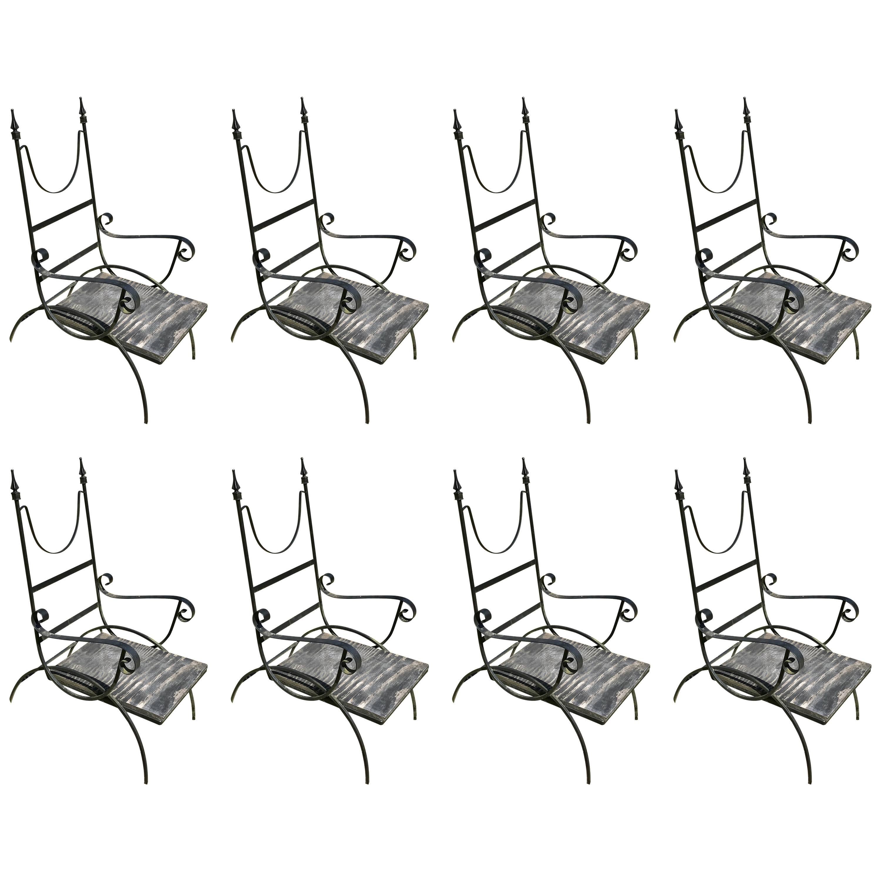 Amazing set of eight wrought iron high back outdoor patio chairs.  Made in Italy for Catskill NY mountain resort circa 1960's.  Great lines and design, very sturdy and heavy, no breaks, no rust. Need to be powder coated or painted. Seats are marine