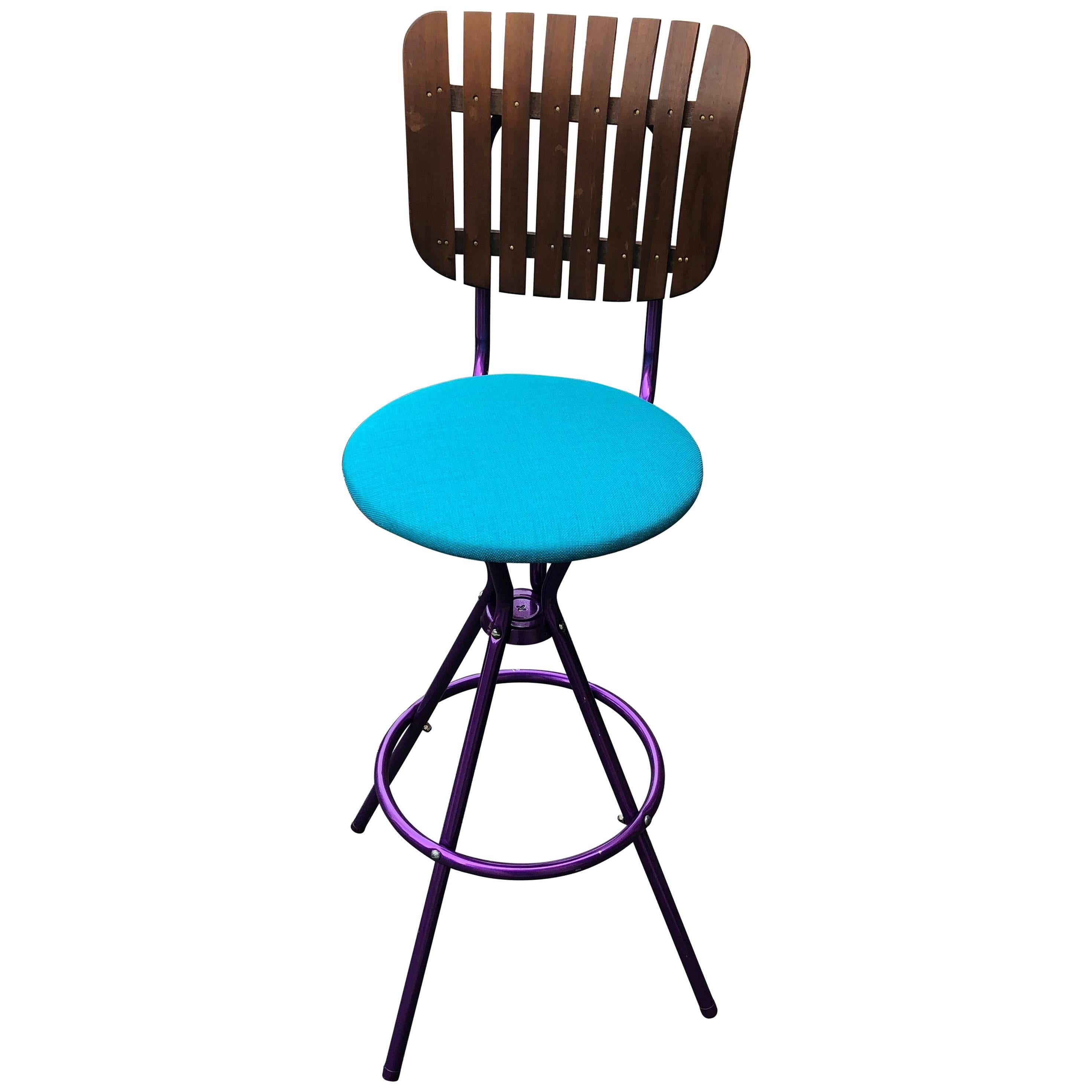 Violet Mid-Century Modern Arthur Umanoff style bar stool with wooden back support.
Newly upholstered and powder-coated in a vibrant ultra violet paint.
The seat height is 28 inches
  