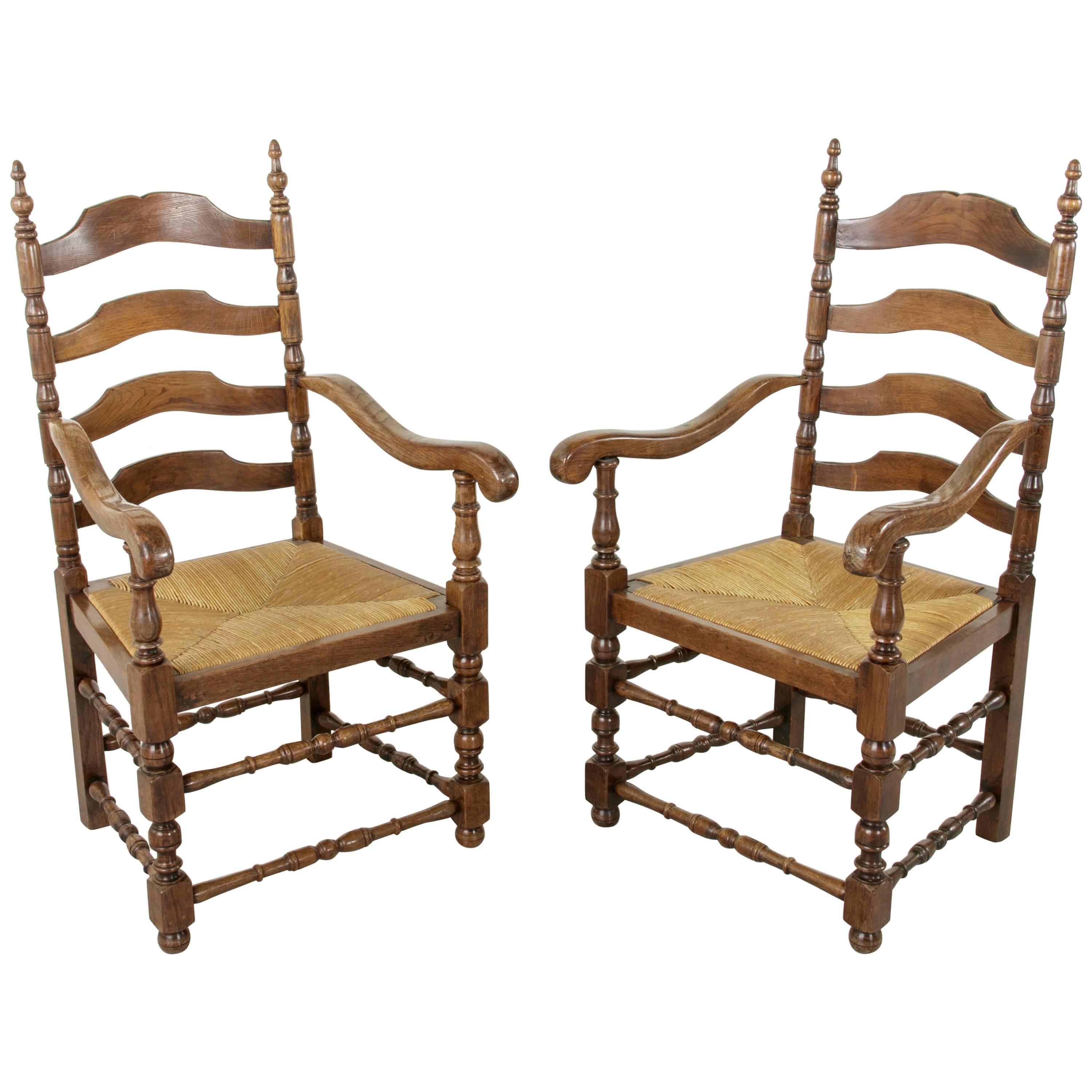 Pair of Louis Philippe Style French Oak Ladder Back Armchairs with Rush Seats