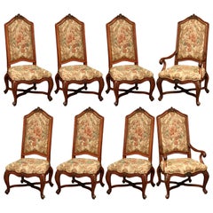 Important Set of Eight French Carved Walnut Dining Chairs and Armchairs