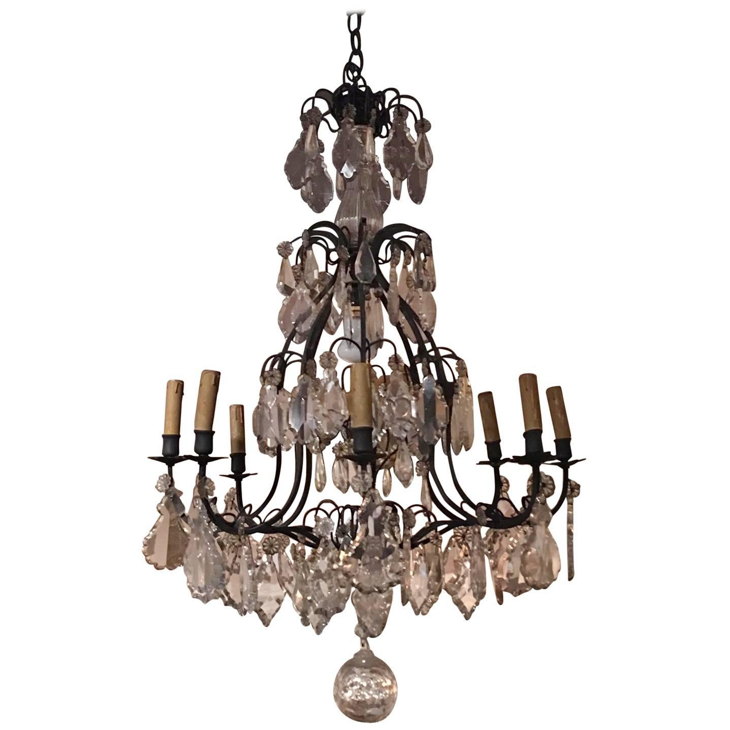 French Louis XVI Style Crystal and Iron Eight-Light Chandelier, 19th Century
