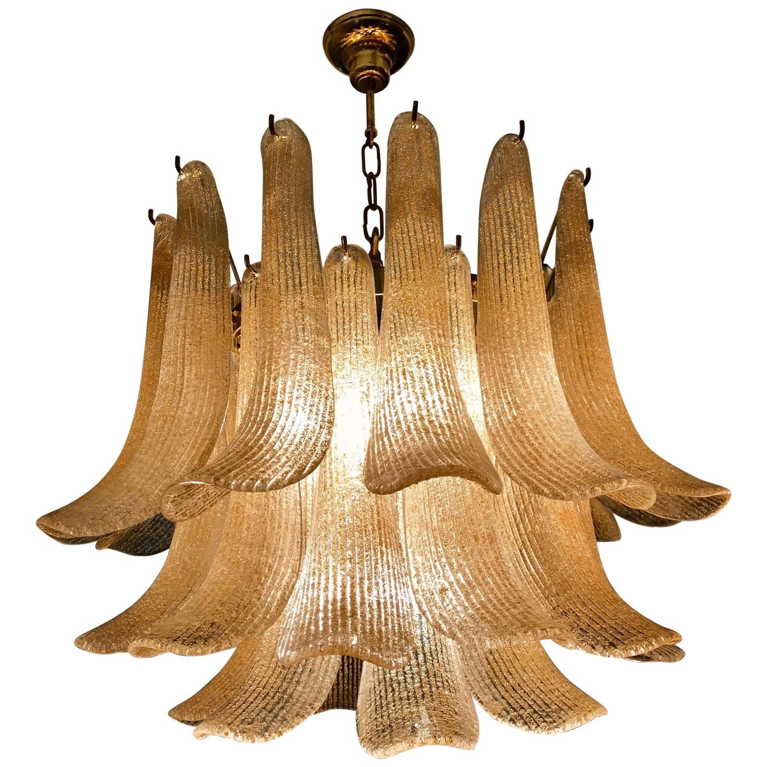 Fantastic mazzega chandelier with gold glass petals, gilt metal frame. It has big monumental petals gold glass. The product is a Mazzega or La Murrina Murano. The glasses are very high quality; the photos do not do the beauty, luster of these