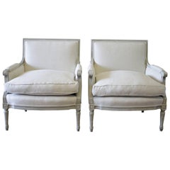 Pair of 20th Century Painted and Upholstered Louis XVI Style Bergere Chairs