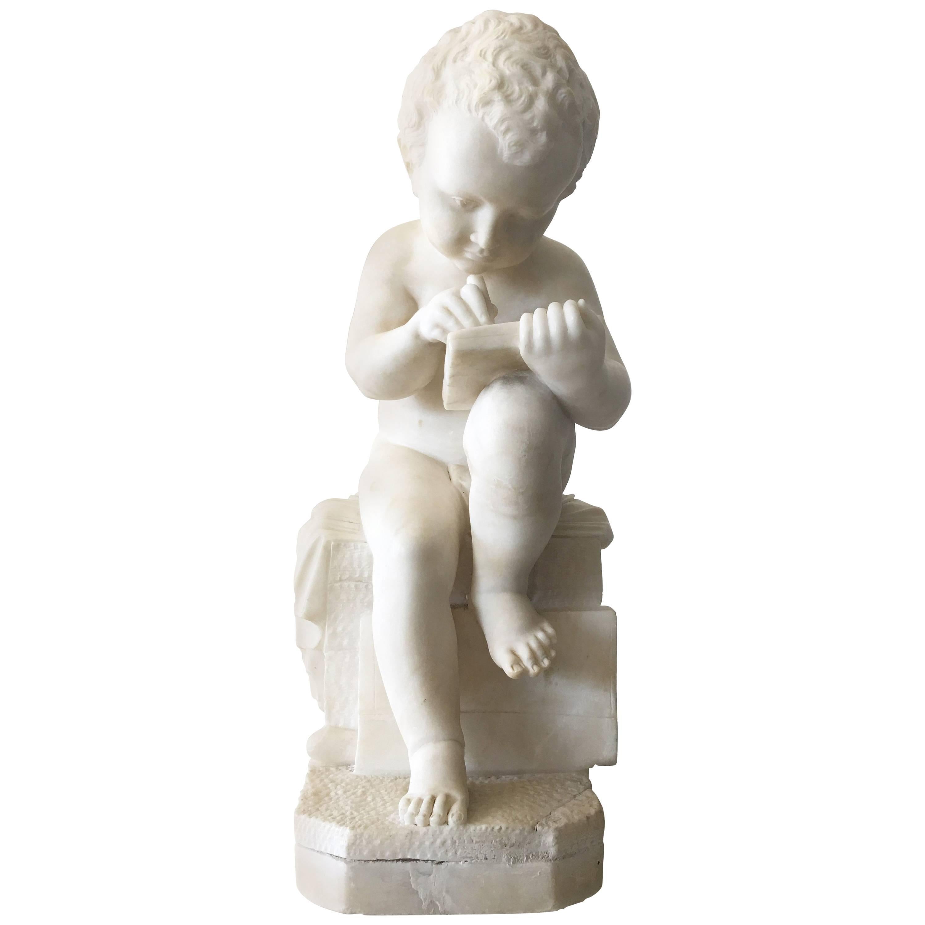 Carved White Marble Sculpture of a Child Writing For Sale