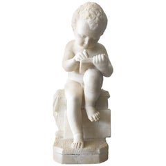 Carved White Marble Sculpture of a Child Writing