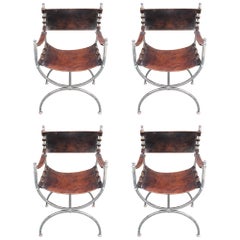 Four Leather and Chrome Curule Armchairs, circa 1970, in the Style Maison Jansen