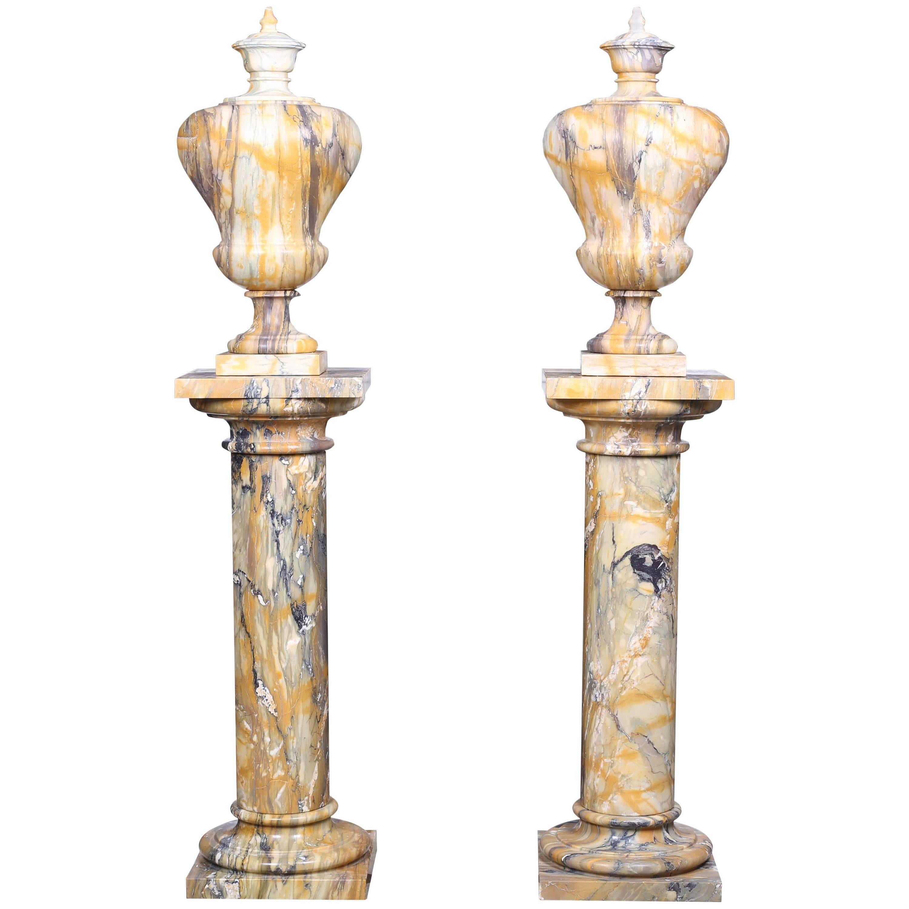Pair of Vintage Grand Marble Urns on Column Plinths in the Neoclassical Style For Sale