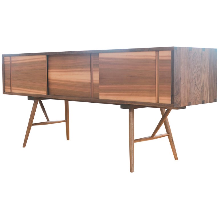 Pelican Modern Walnut Sideboard with Sliding Doors and Turned Legs For Sale at 1stdibs