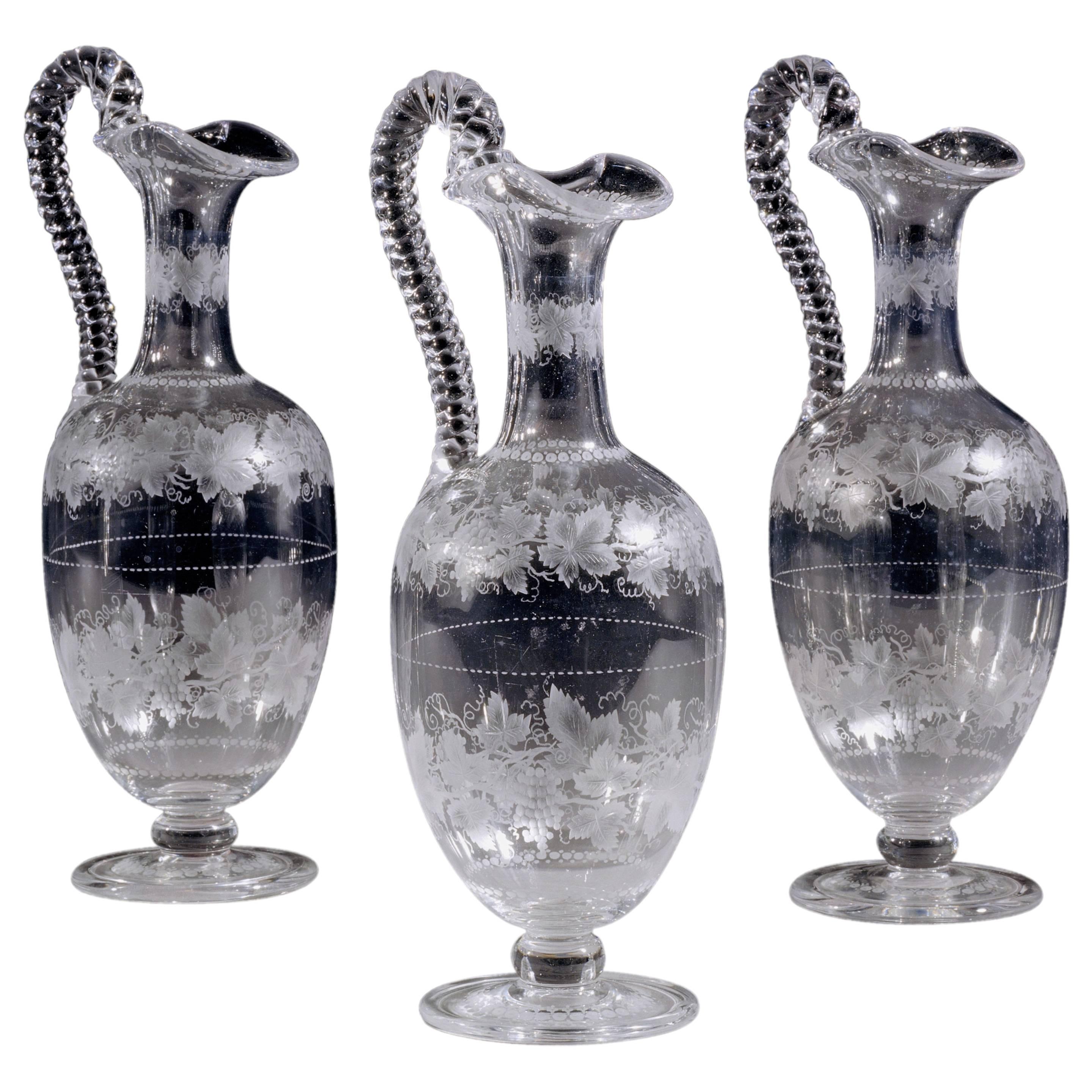 Set of Three Victorian Engraved Wine Jugs For Sale