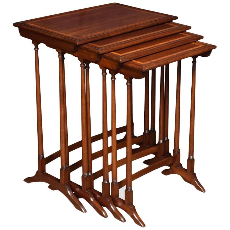 Nest of Four Mahogany Inlaid Tables