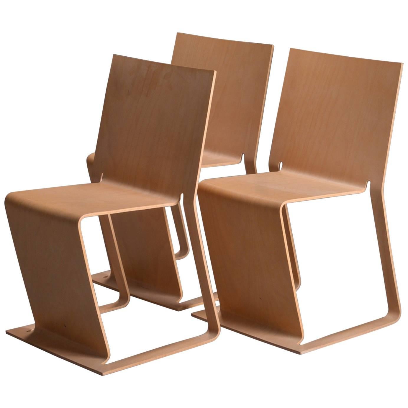 Three Stacked Swedish lForm Chairs