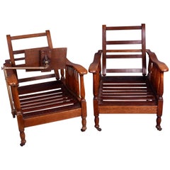 Pair of Edwardian Oak Steamer Chairs, One with a Carters Patent Reading Stand