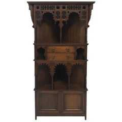 Liberty & Co. a Moorish Walnut Corner Cupboard with Musharabieh Turned Details