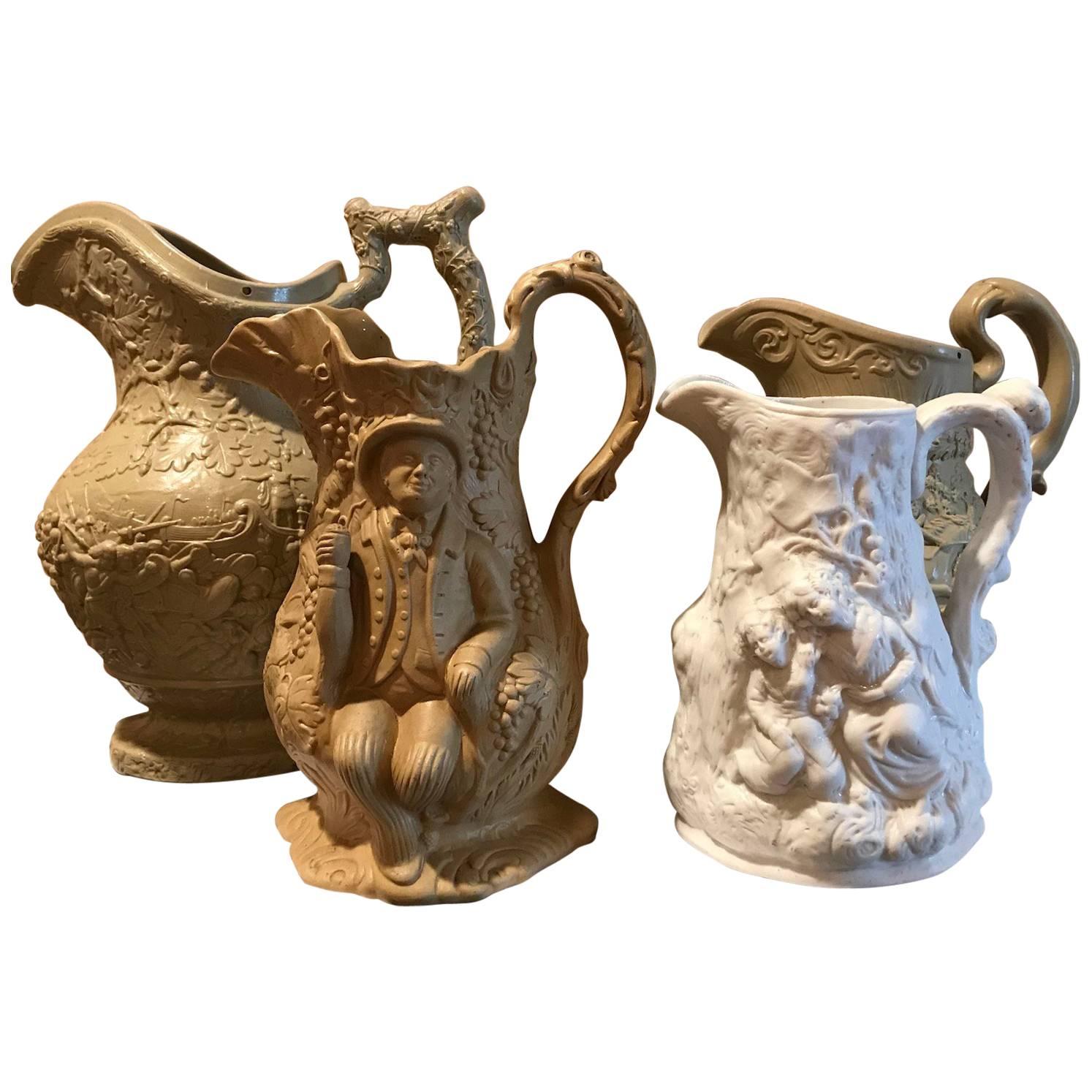 Lot of Four 19th Century Ceramic Relief Pitchers For Sale