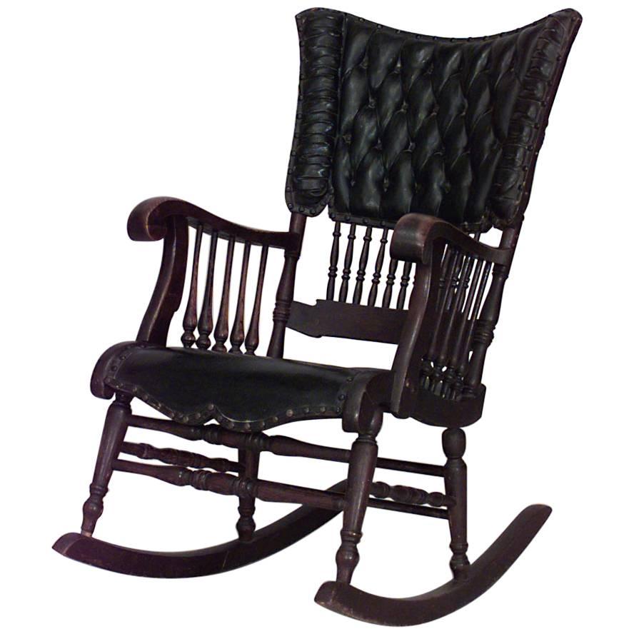American Victorian Oak & Black Tufted Leather Rocking Chair with Spindle Design