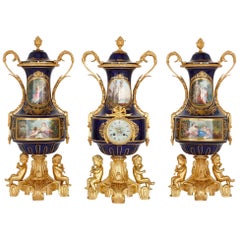 Antique Rococo Style Porcelain and Gilt Bronze Clock Garniture