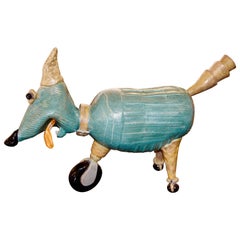 Terracotta Comic Caricature of a Dog on Wheels