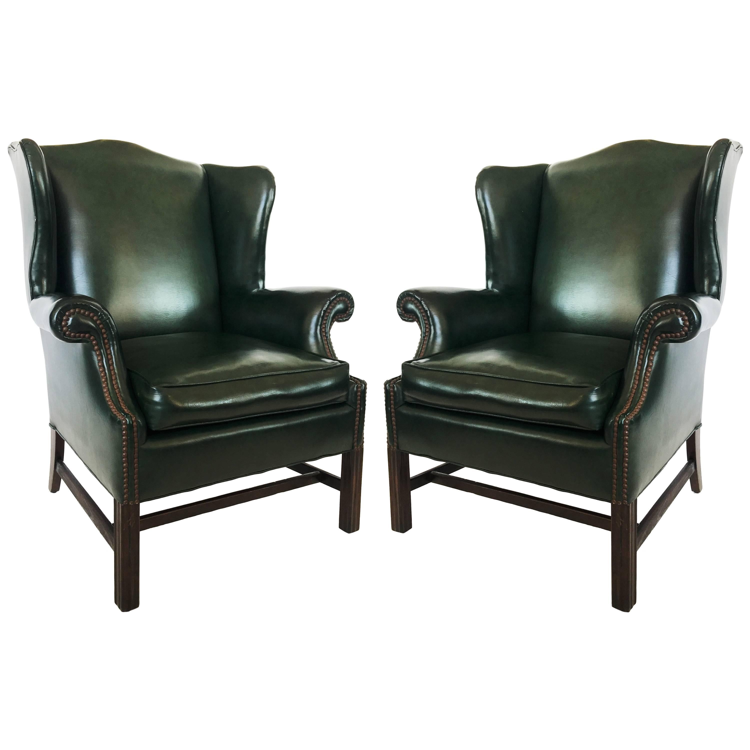 Pair of Chesterfield Tufted Dark Green Leather Wingback Chairs For Sale