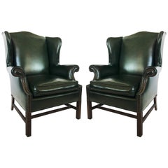 Antique Pair of Chesterfield Tufted Dark Green Leather Wingback Chairs