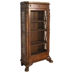 Bibliothèque-armoire de style Empire français en noyer du 19ème siècle