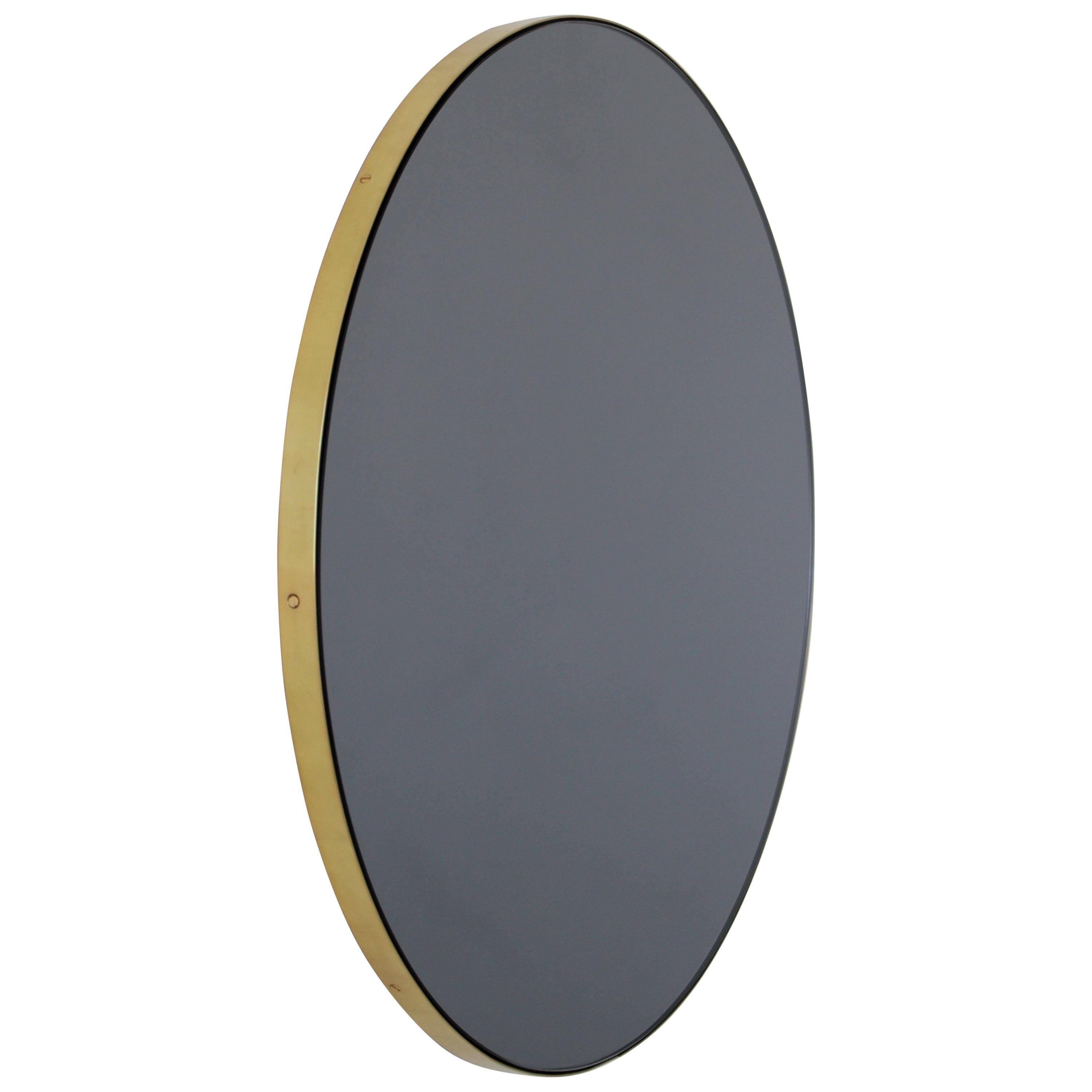 Orbis Black Tinted Round Contemporary Mirror with a Brass Frame, Small For Sale