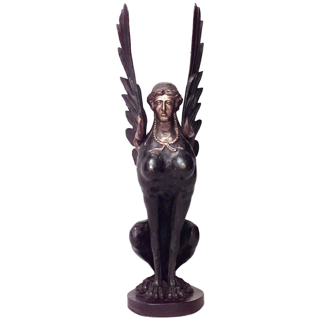 French Empire Ebonized and Gilt Sphinx