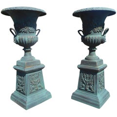 Pair of Cast Iron Urns on Pedestal Bases