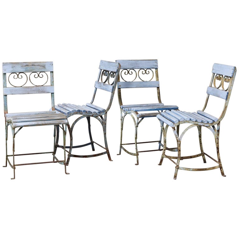 Vintage Wrought Iron Outdoor Table And Four Chairs at 1stdibs