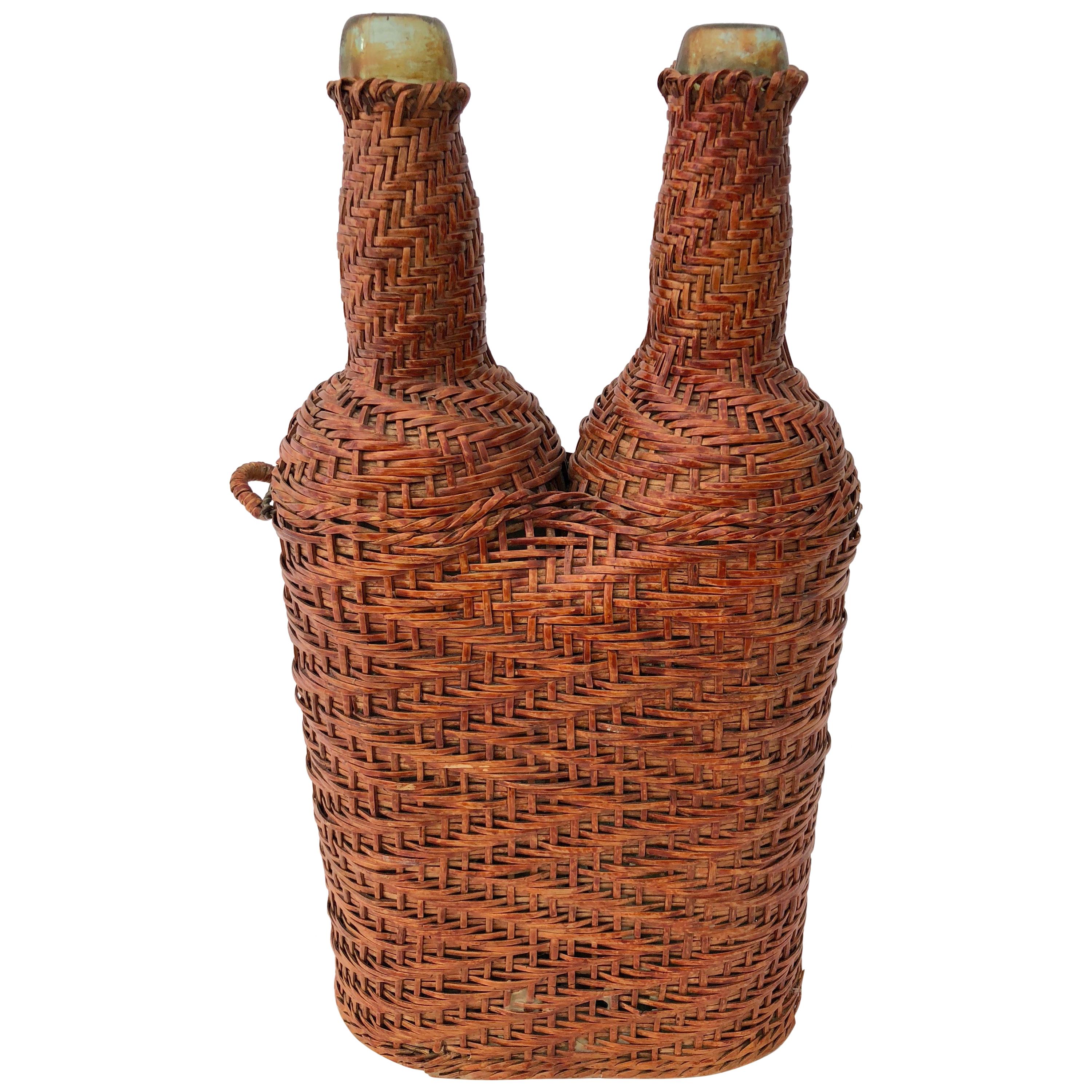 French Hand Blown Bottles Surrounded by Woven Wicker with Detached Handle, Pair For Sale