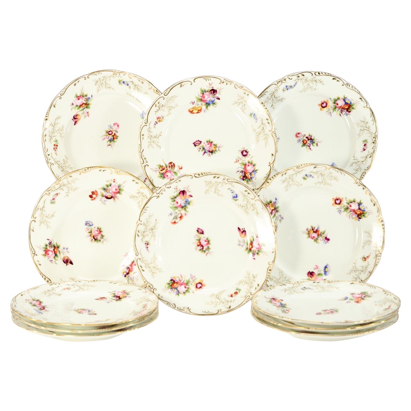 Juego de 12 Platos de Postre del S. XIX Pintados a Mano Flores de Esmalte Policromado Guarnición Dorada en venta