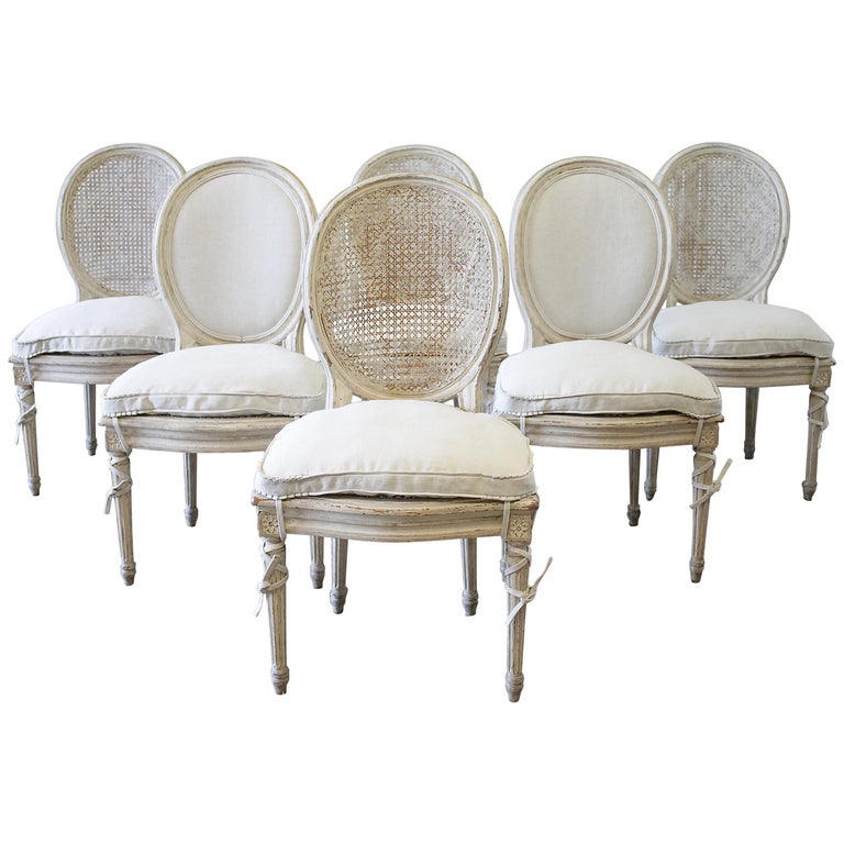 Six Early 20th Century Painted French Louis Xv Style Cane Back Set Of Six Early 20th Century Painted Cane Back And Upholstered Dining Chairs