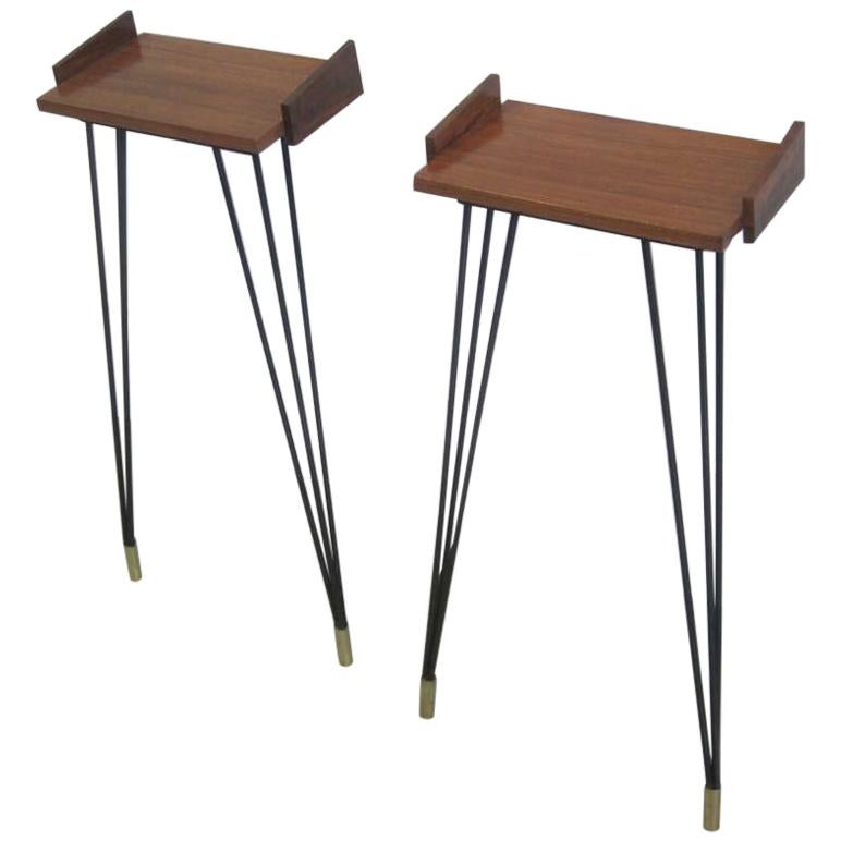 Rare, elegant pair of Italian Midcentury Modernist wall console tables or bedside tables / nightstands attributed to Osvaldo Borsani, circa 1950. The pieces are an elegant balance of materials. Long, sexy, black enameled steel legs are contrasted