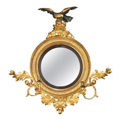 Regency Period Convex Mirror with a Rocaille Pediment Surmounted with an Eagle