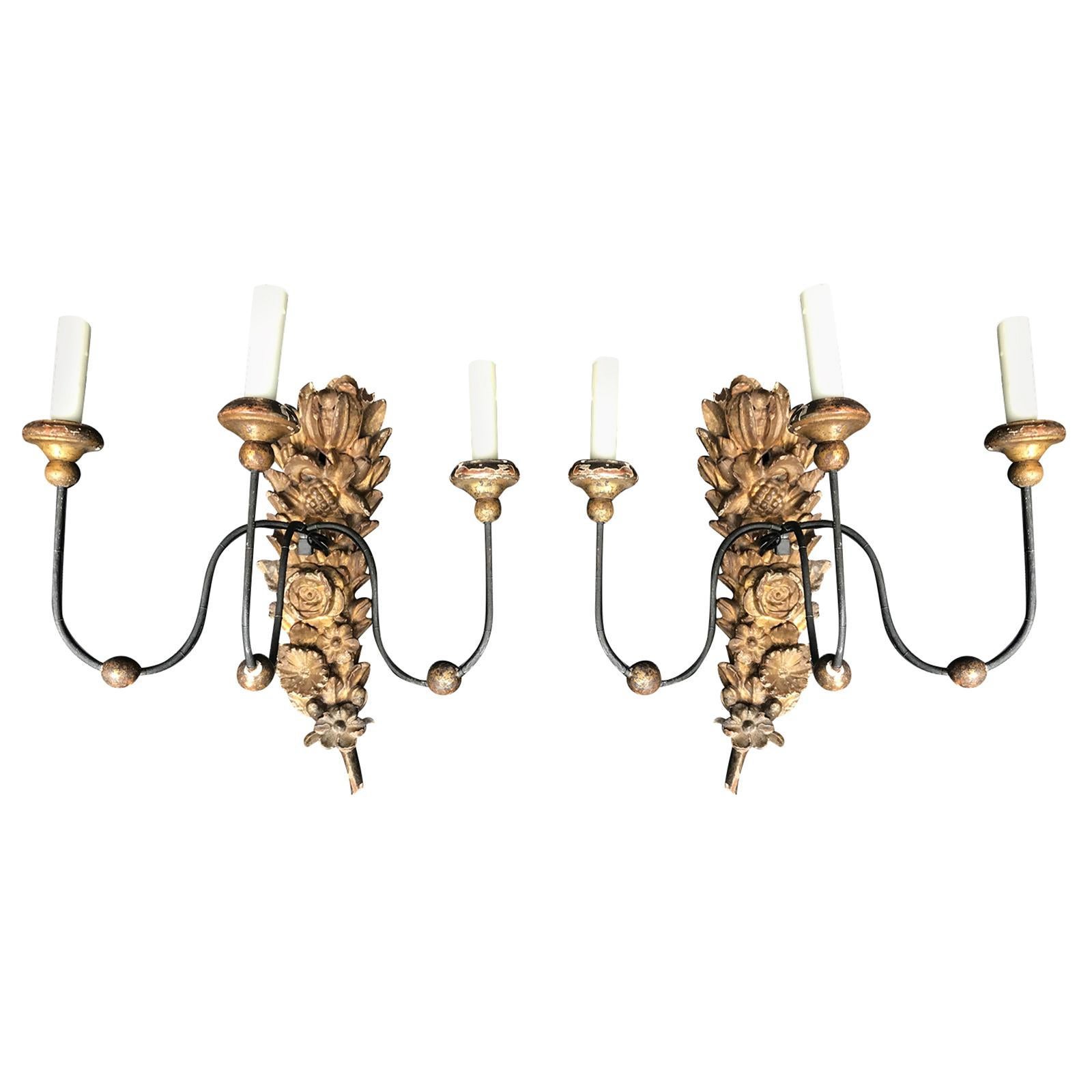 Pair of 18th Century Italian Carved and Gilded Three-Arm Sconces For Sale