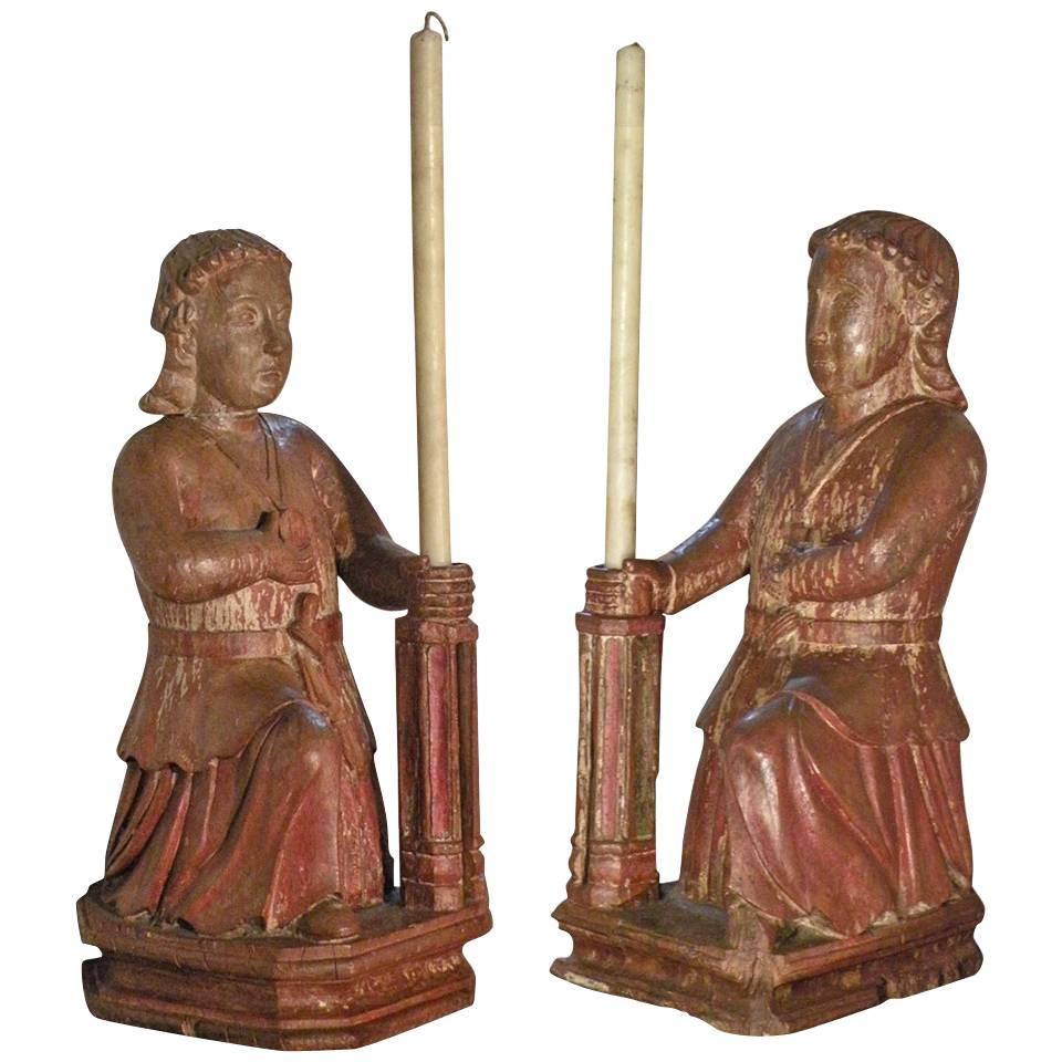 Pair of Colonial 17th century exotic wood candle-holding Sculptures
