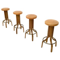 Four Postmodern Camel Color Leather & Walnut Plywood Revolving Stools, Italy