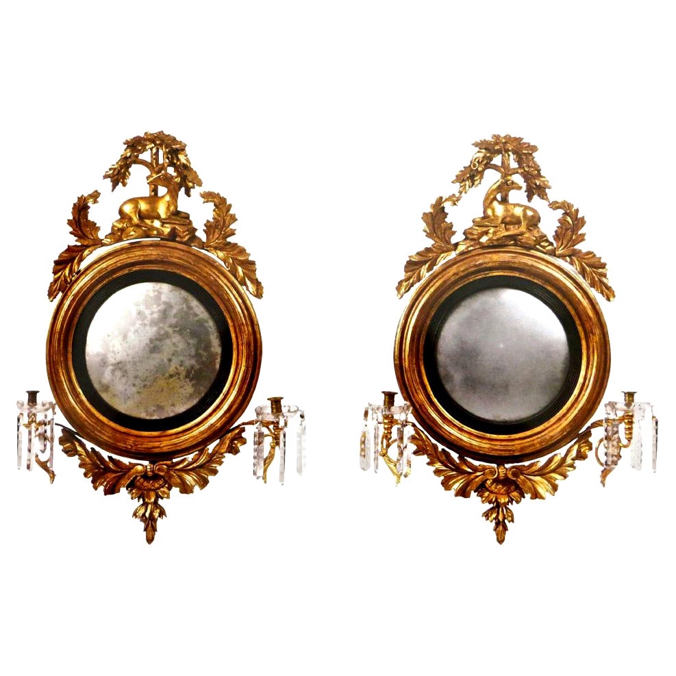 Pair of Georgian Carved "Stag" Giltwood Convex Mirrors, circa 1820