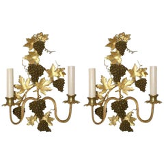 Coppia di appliques in bronzo dorato color uva