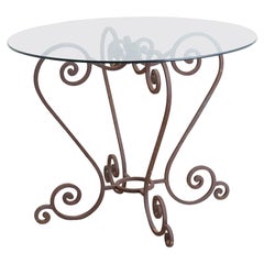 Mesa de jardín de hierro forjado con volutas para el desayuno o el patio